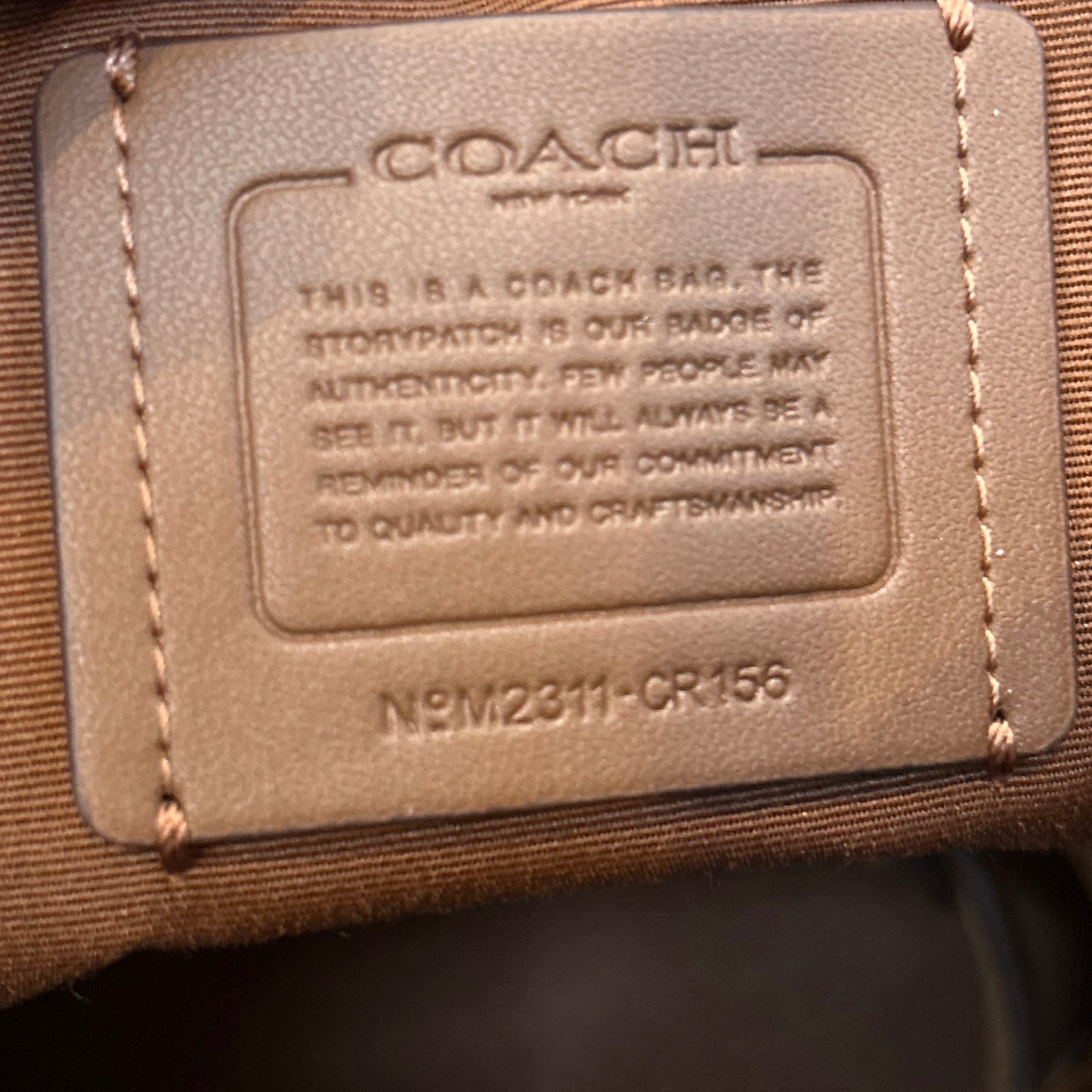 Tan Coach