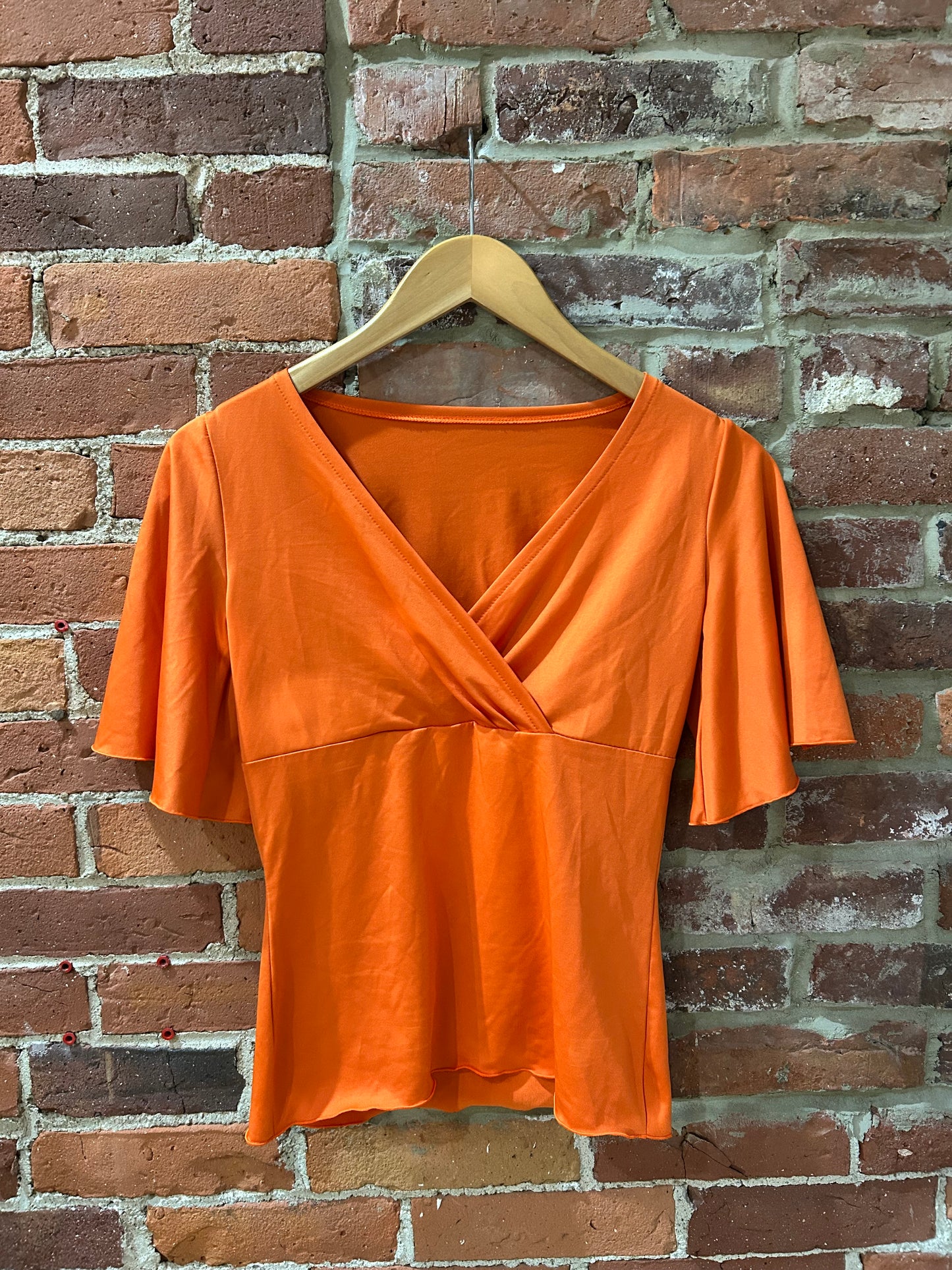 Orange V-neck blouse