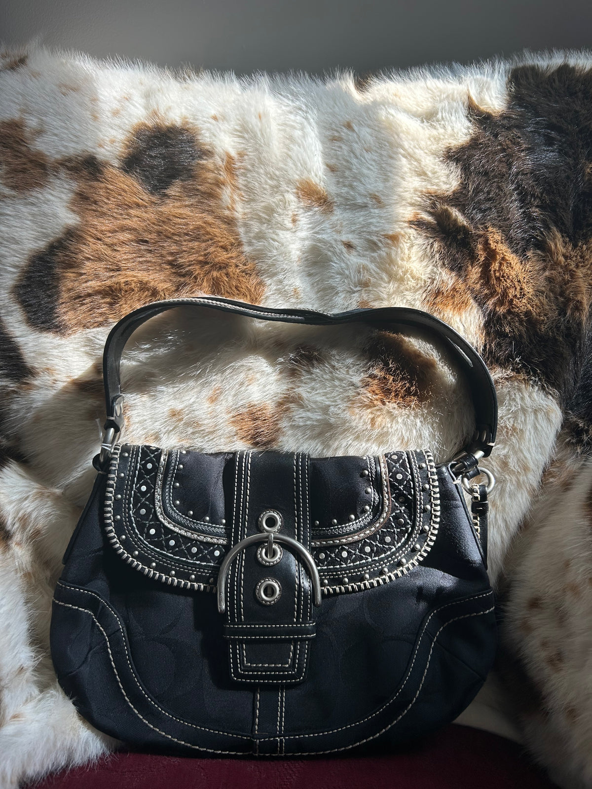 Coach Soho signature studded stitched flat hobo ￼