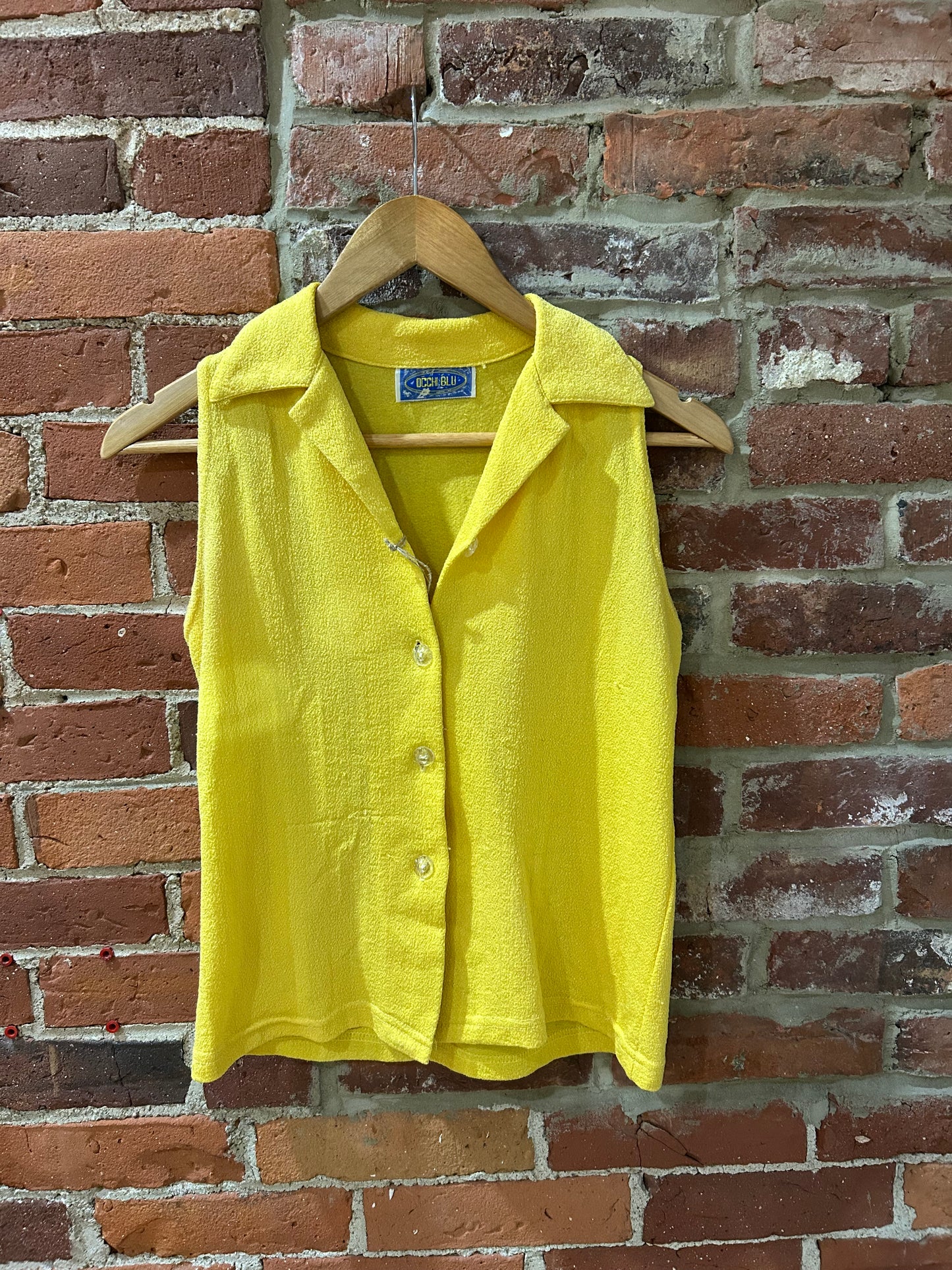 Sleeveless button-up