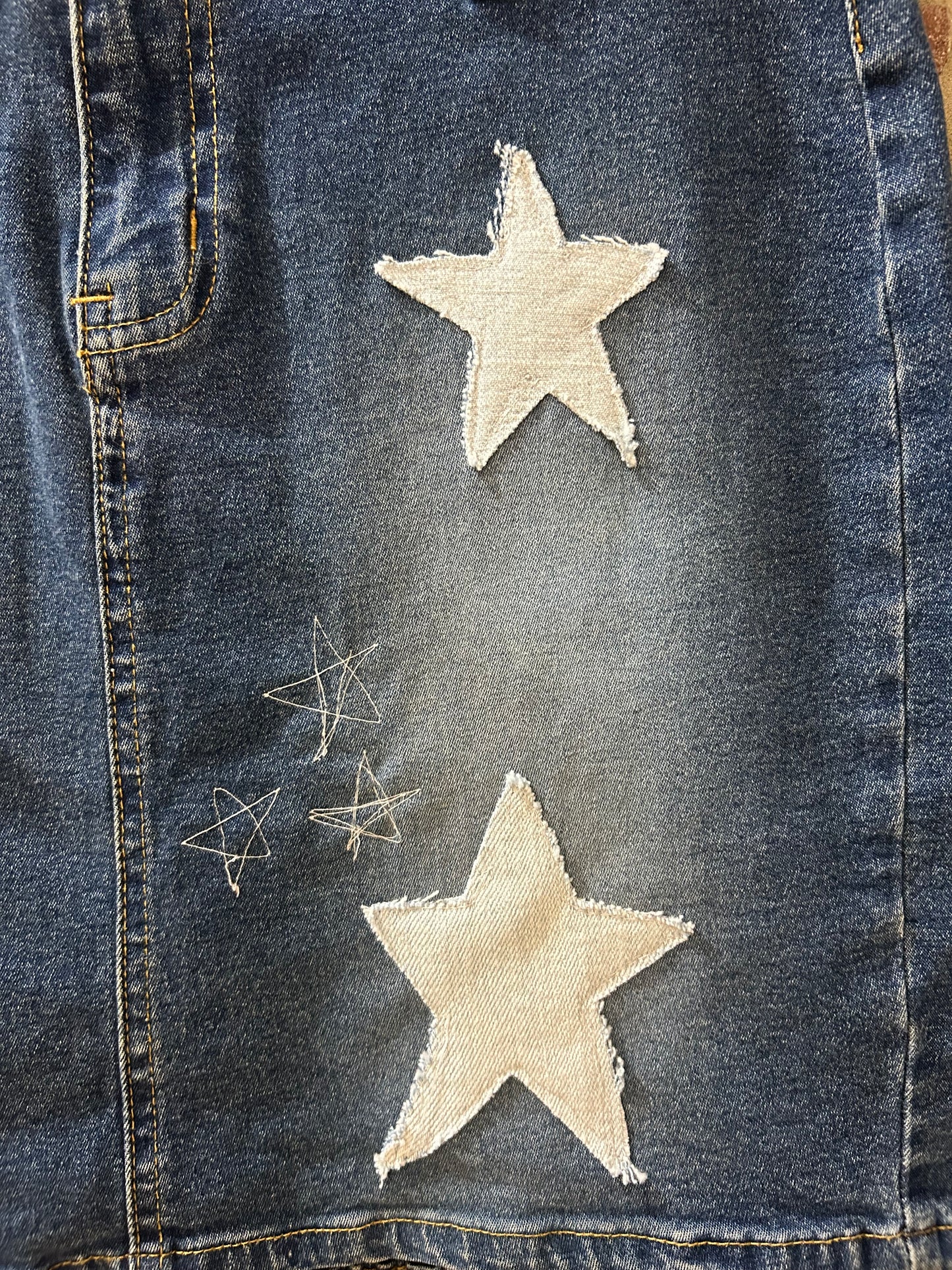 Upcycled, embroidered denim skirt