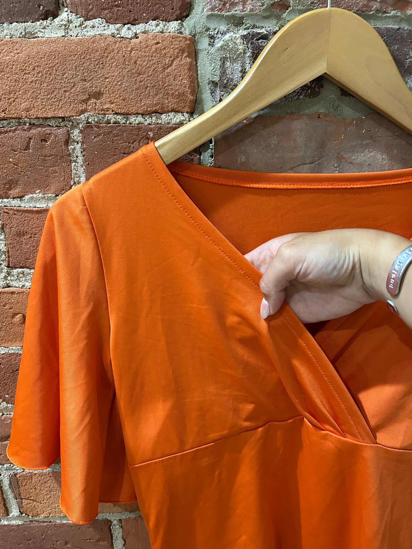 Orange V-neck blouse