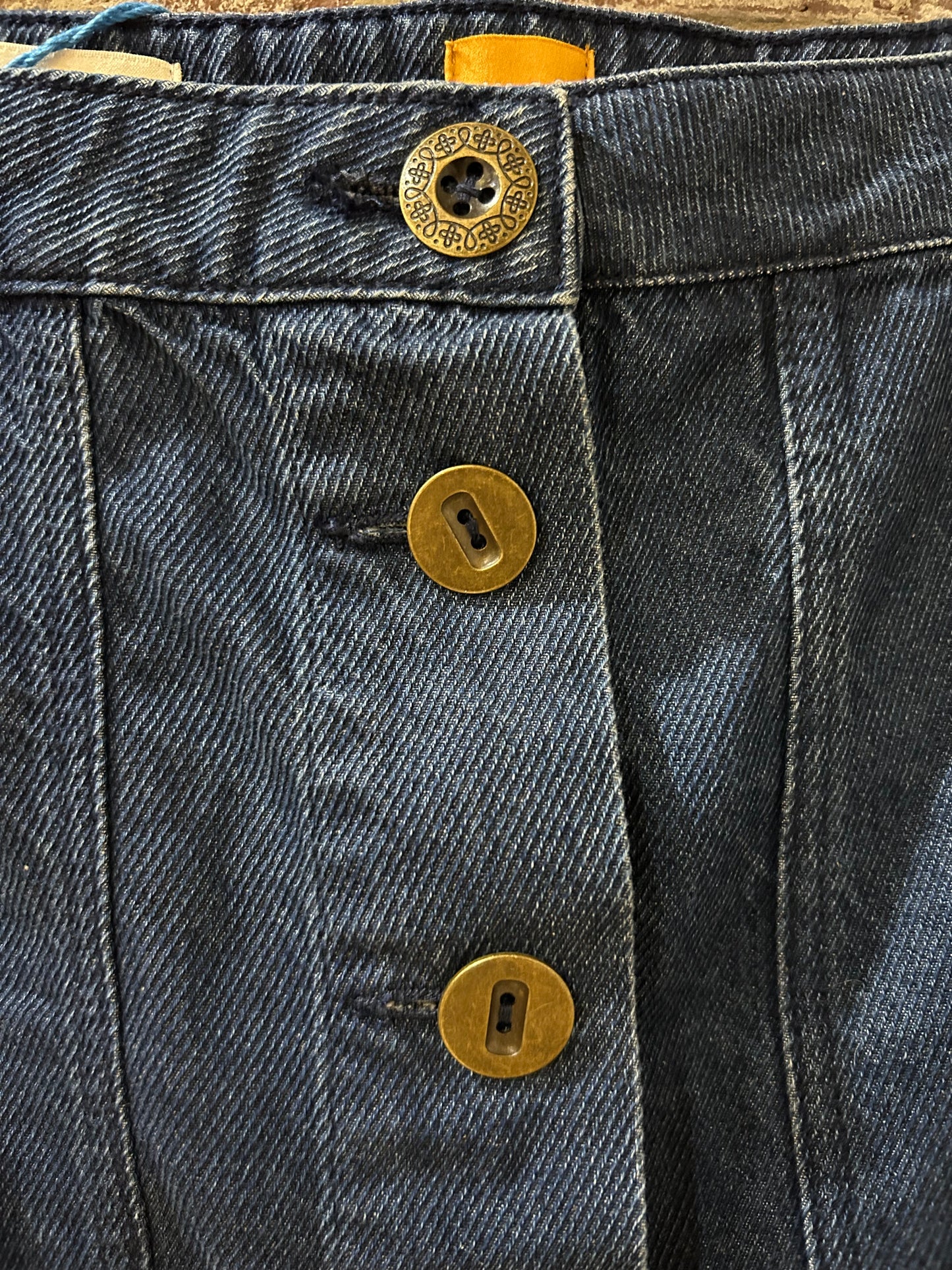 Button-front denim skirt