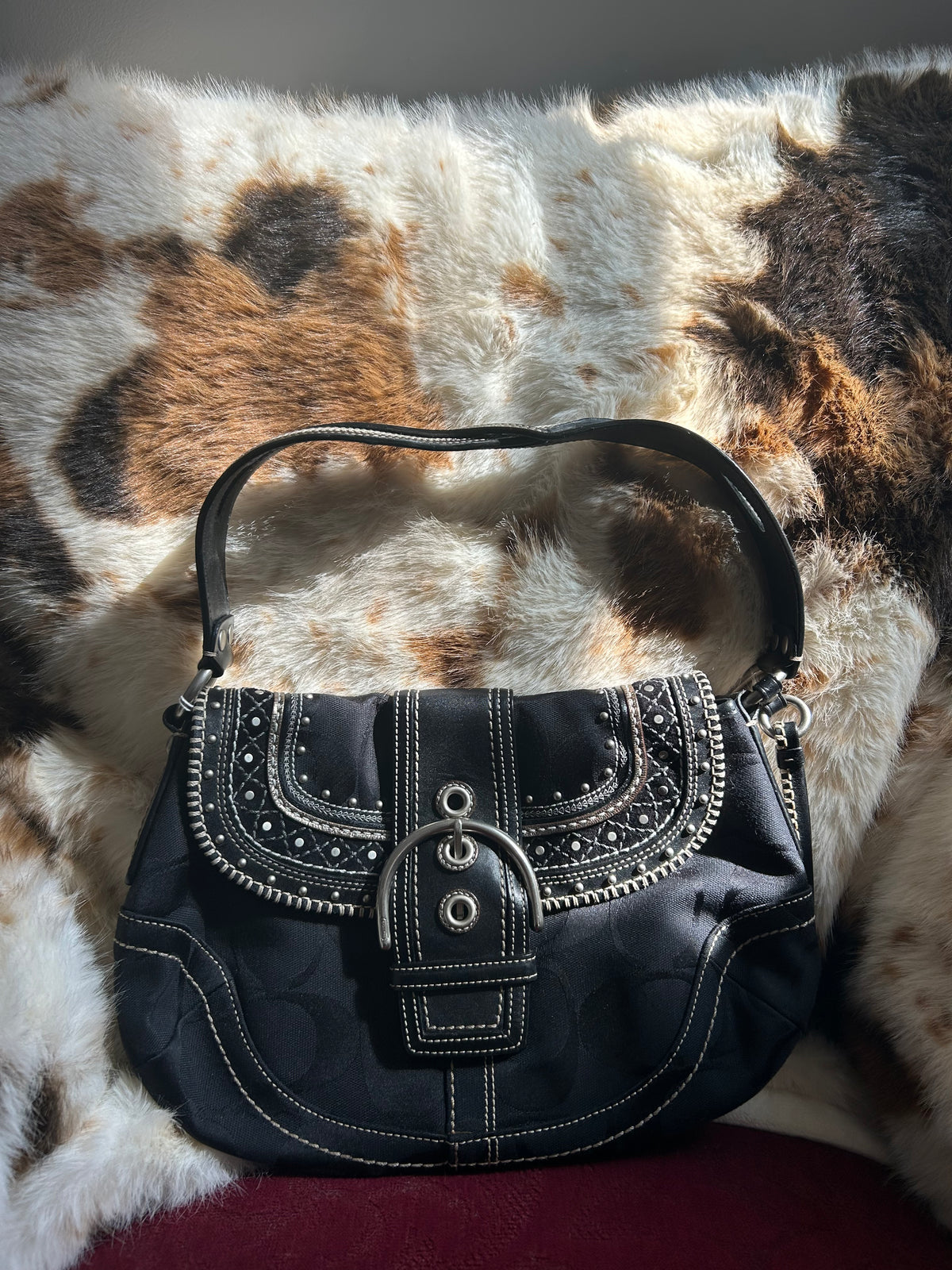 Coach Soho signature studded stitched flat hobo ￼
