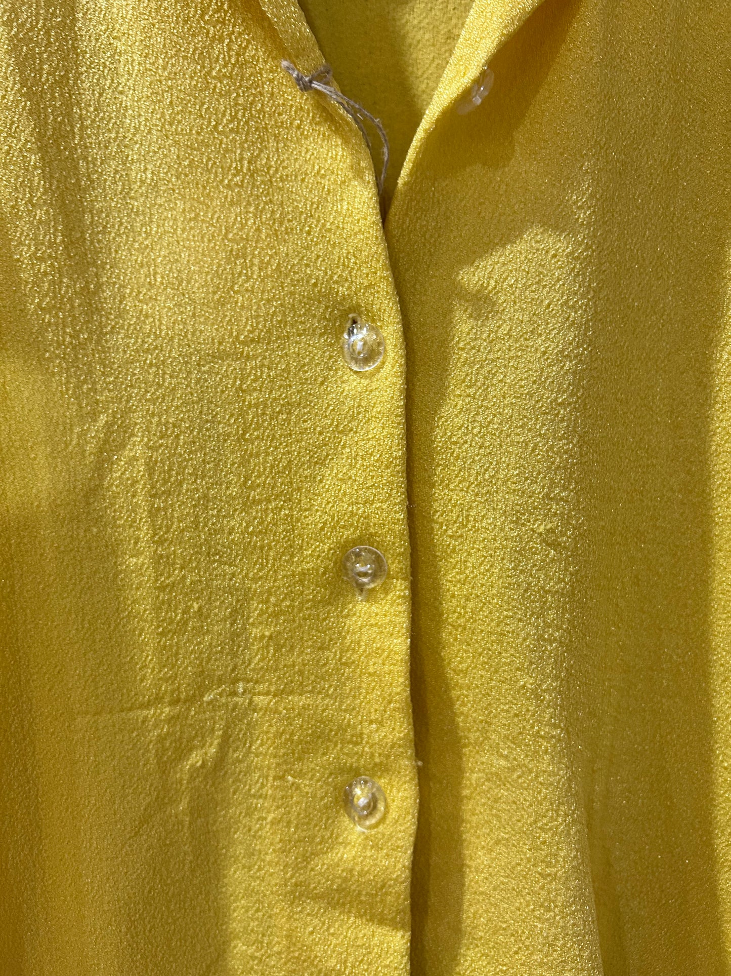 Sleeveless button-up